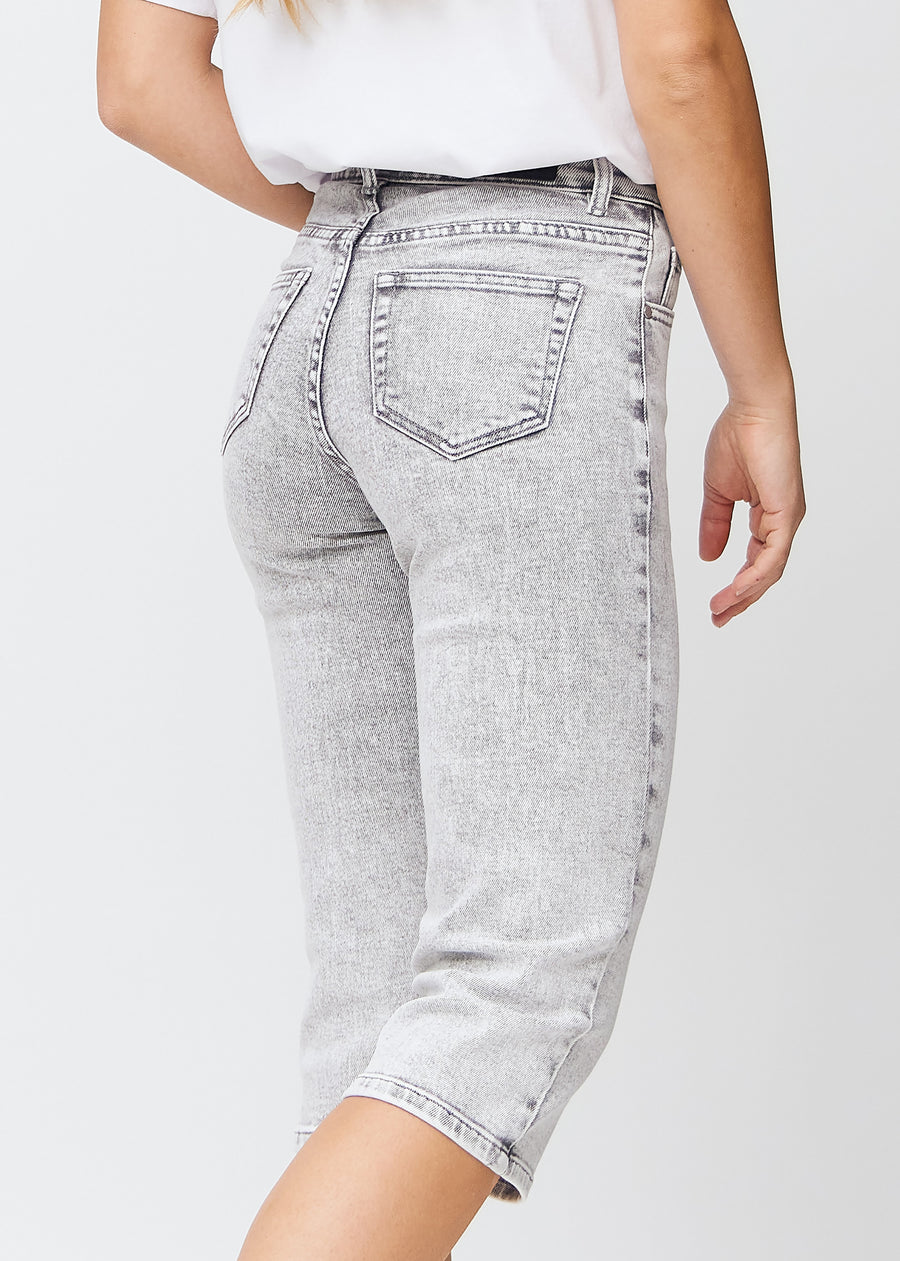 Light grey denim regular capris seen from the back up close to show details.