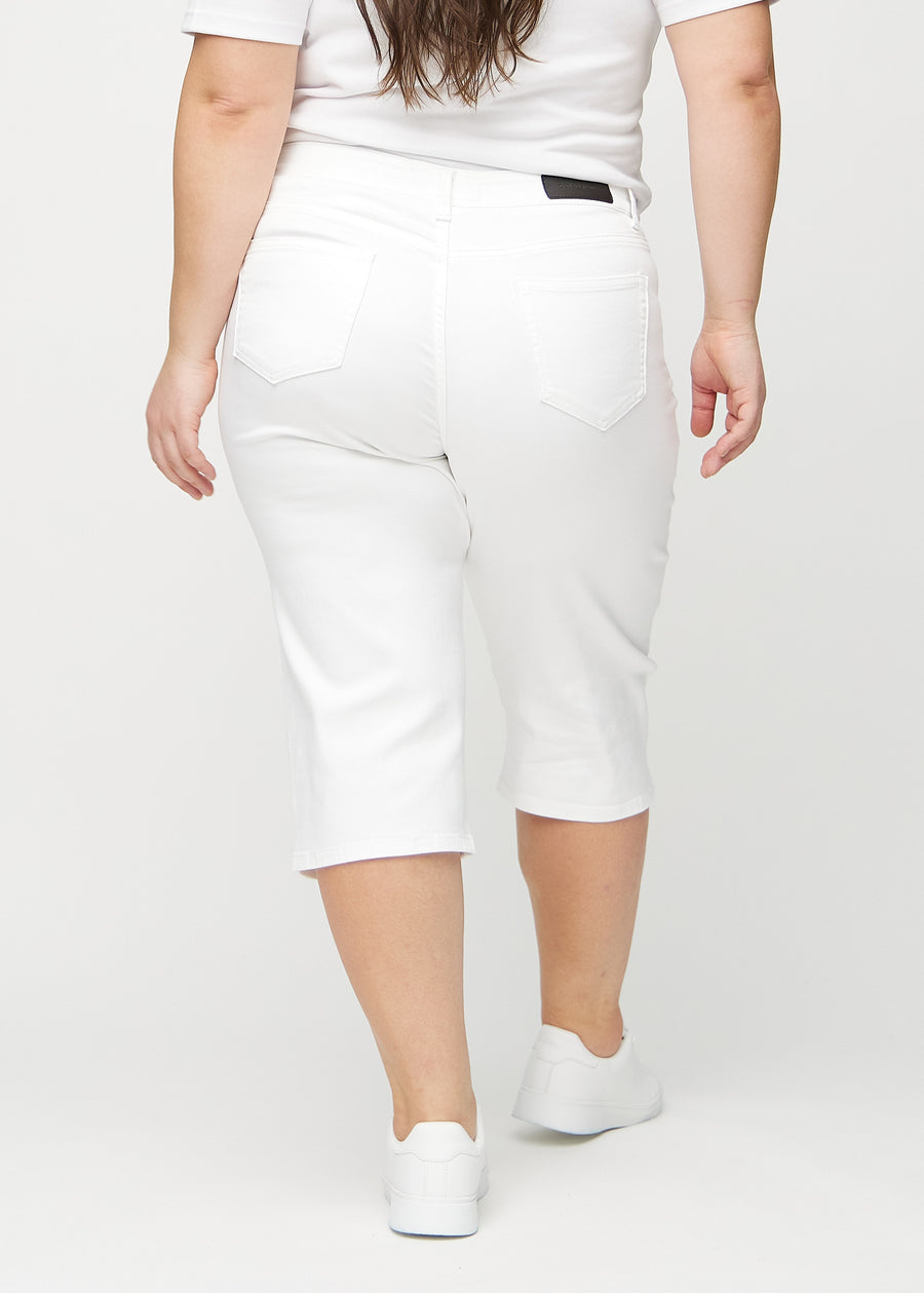 White regular capris seen from the back on a plus-size model, so the entire product can be seen.
