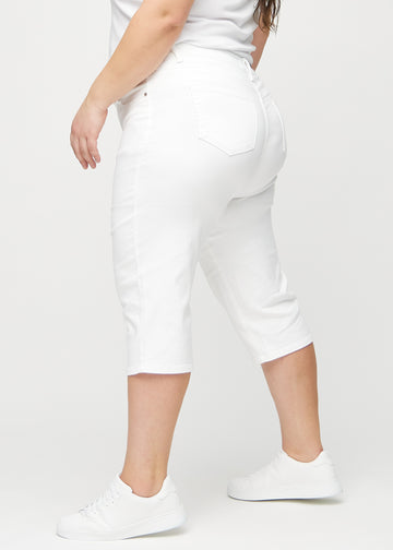 White regular capris seen from the side on a plus-size model.