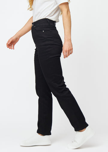 Black high-waisted regular jeans seen from the side on a model.