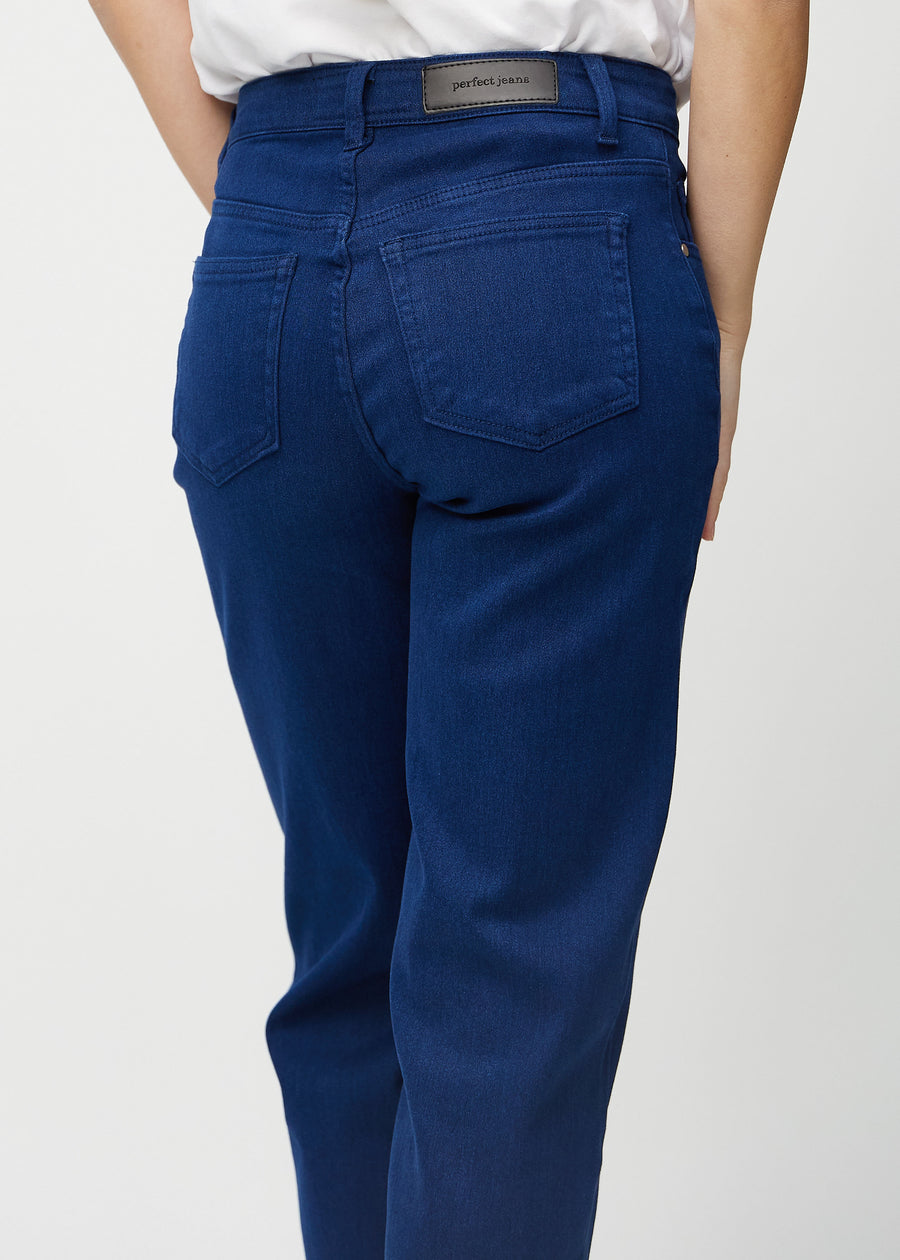 Dark blue loose jeans seen from the back close up to show details.