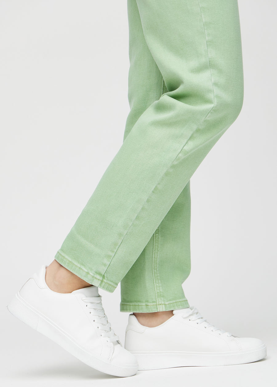Regular jeans for women in light green, color Mints. Close-up at the ankles on a model, showing the straight leg openings.