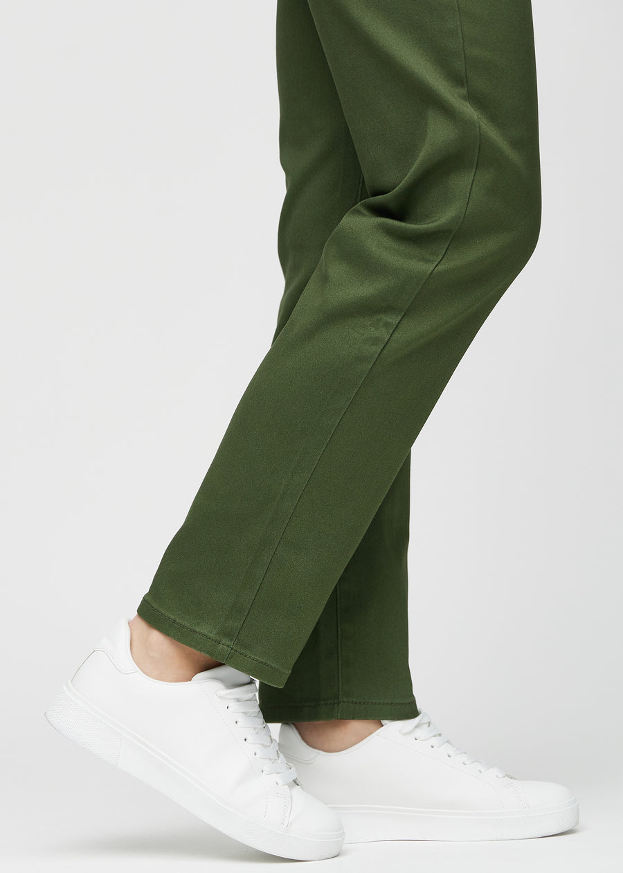Regular jeans for women in dark green, color Renewals. Close-up at the ankles on a model, showing the straight leg openings.
