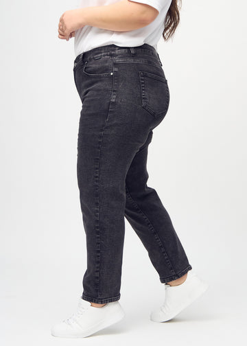 Regular jeans for women in dark grey, color Shadows. Side view on a plus-size model.