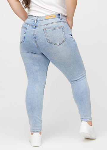 Skinny jeans for women in light blue, color Waves. Back view on a plus-size model, showing the full fit.