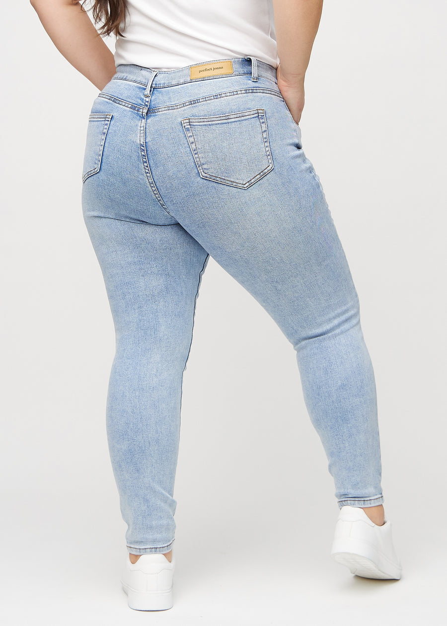 Skinny jeans for women in light blue, color Waves. Back view on a plus-size model, showing the full fit.