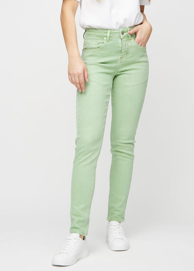 Slim jeans for women in light green, color Mints. Front view on a model, showing a close fit through the leg with a little more room at the ankle.