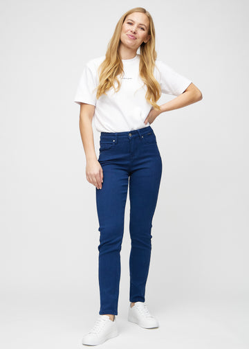 Slim jeans for women in dark blue, color Royals. Full-length view of a model wearing the jeans.