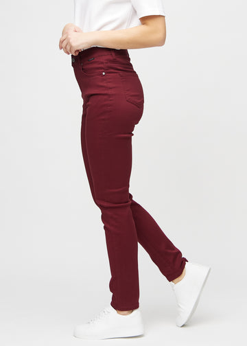 Slim jeans for women in dark red, color Santas. Side view on a model.