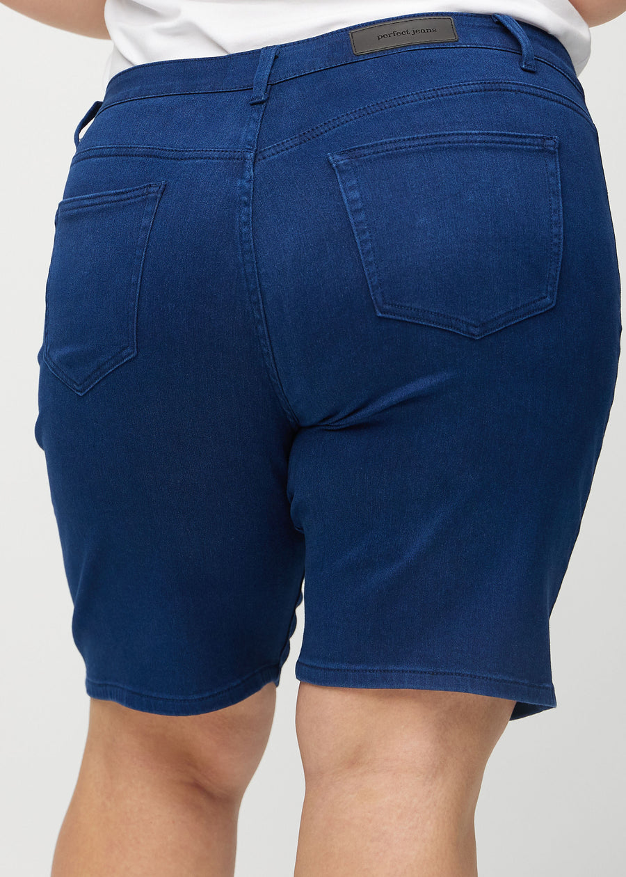 Dark blue regular middle shorts seen from the back close up on a plus-size model to show details.