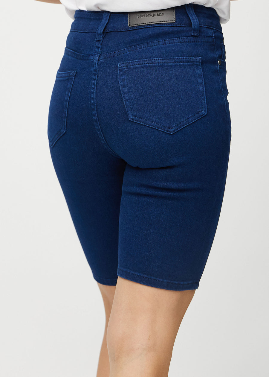 Dark blue skinny middle shorts seen from the back close up to show details.