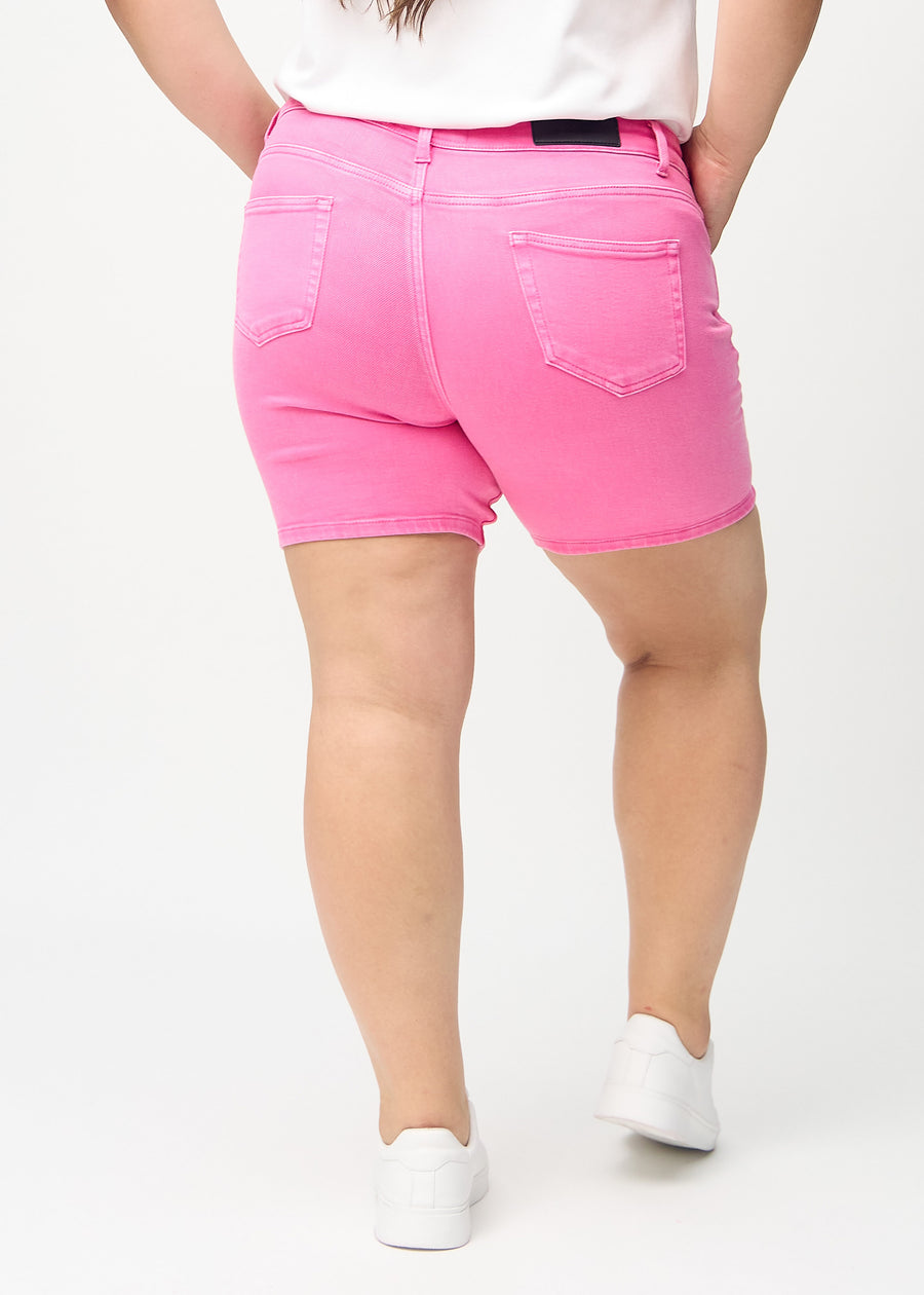 Light pink skinny short shorts seen from the back on a plus-size model, so the entire product is visible.