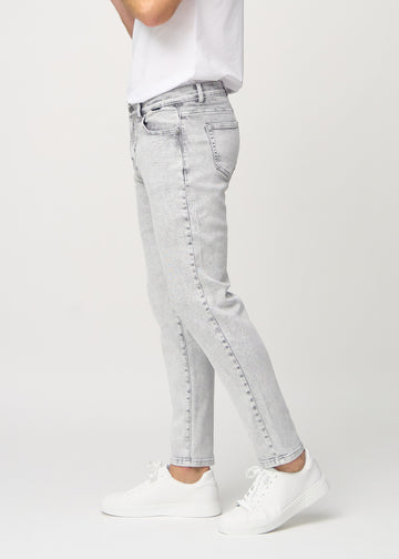 Light grey denim regular jeans seen from the side on a model.