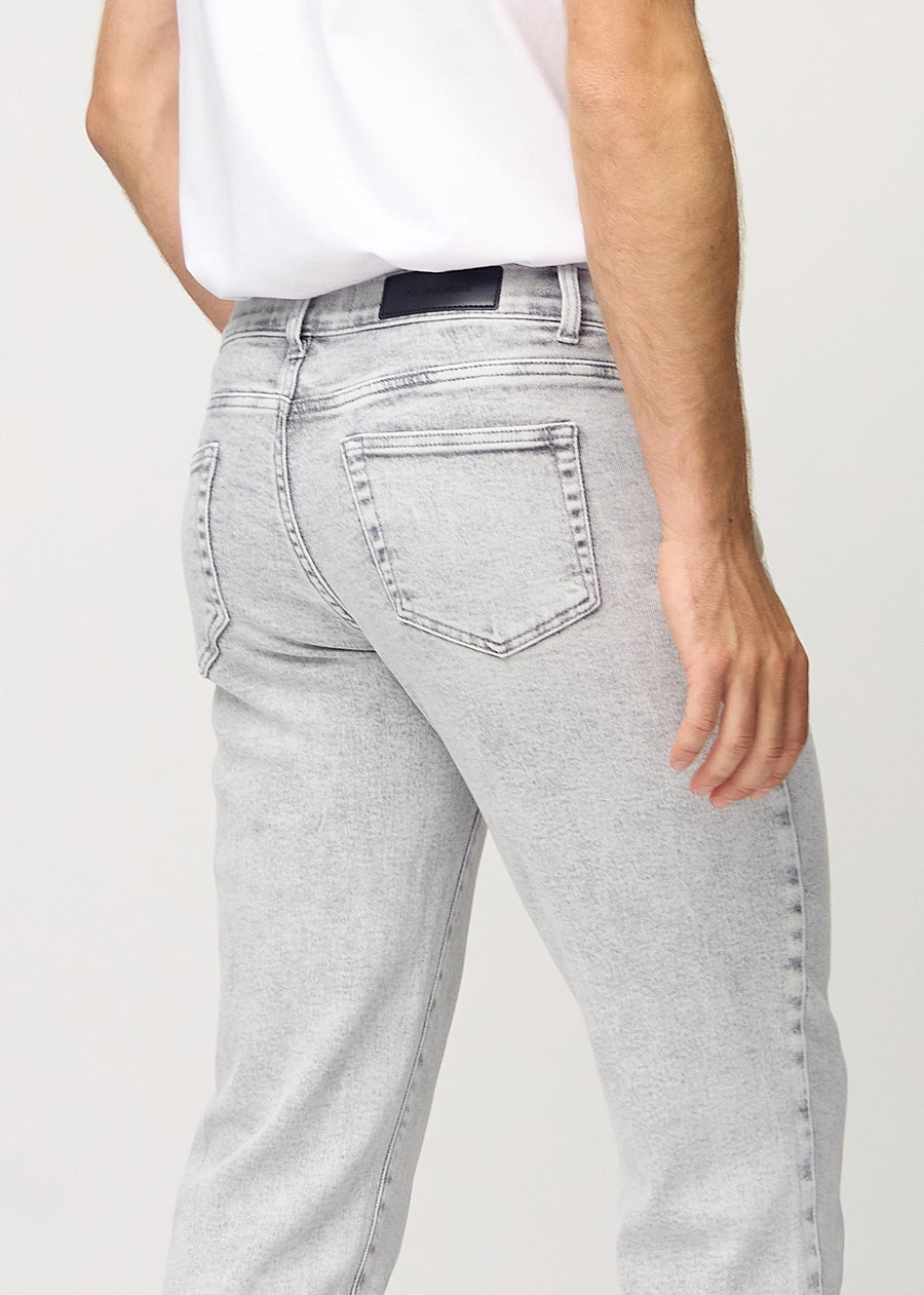 Light grey denim regular jeans seen from the back close up to show details.