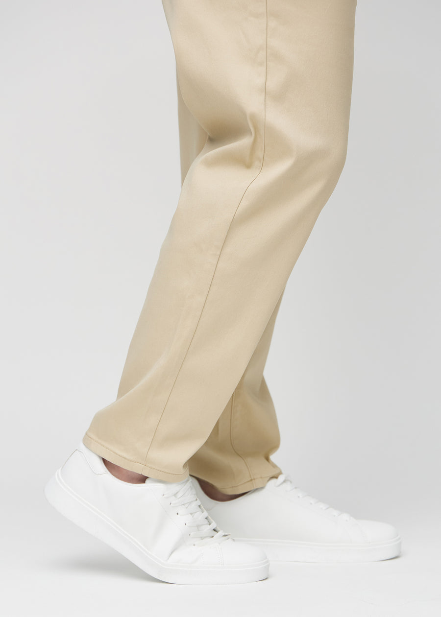 The ankles of a plus-size model, so you can see how loose the jeans fit.