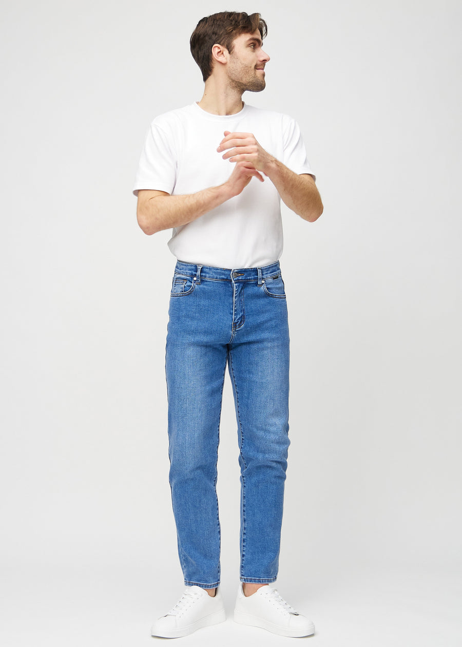 Full image of a model in denim regular jeans.