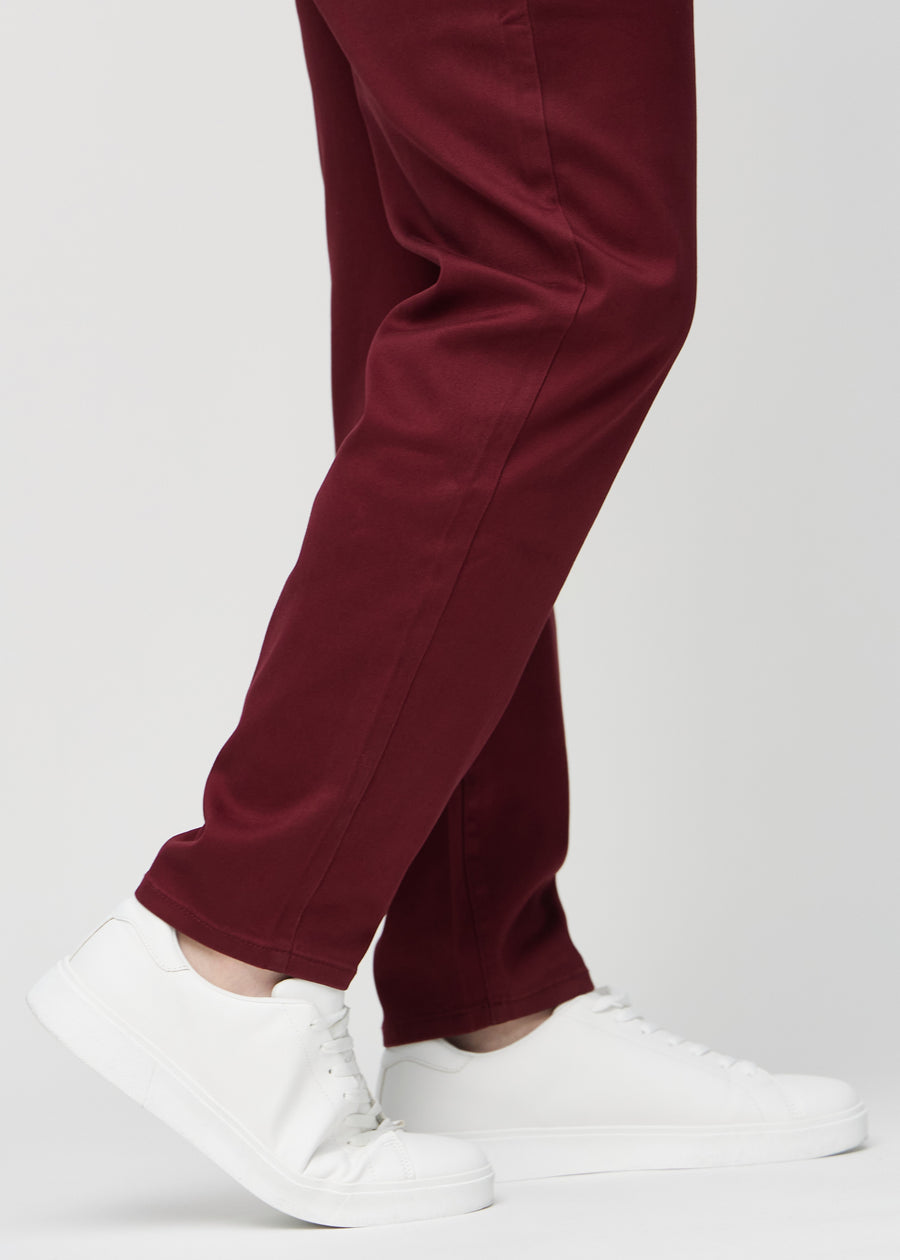 The ankles of a plus-size model, so you can see how loose the jeans fit.