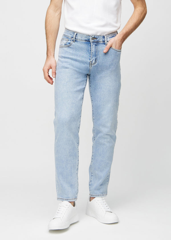 Light denim regular jeans, model name Waves, with a straight leg, front view.