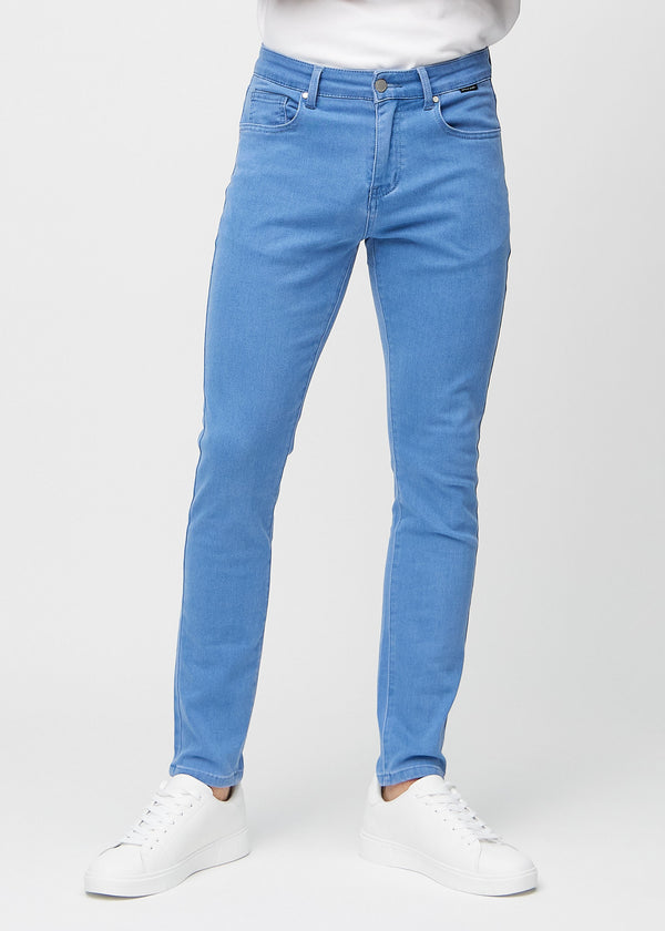 Blue slim jeans, model name Geraniums, fitted closely along the legs, front view.