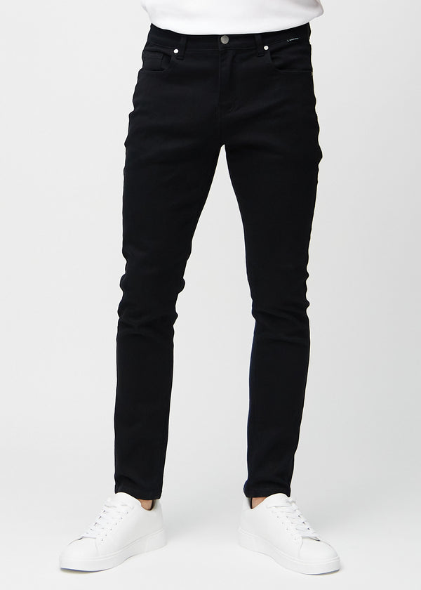 Black slim jeans, model name Ravens, fitted closely along the legs, front view.